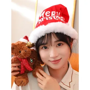 Christmas teddy bear with red Santa hat and glitter scarf for festive holiday gifts