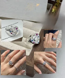 Detail of S925 silver vintage heart ring with colorful zircon stones and open band