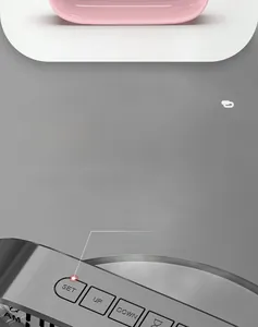 Close-up of smart electronic alarm clock with physical snooze and setting buttons