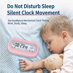 Pink digital alarm clock with transparent weather display and temperature on bedside table