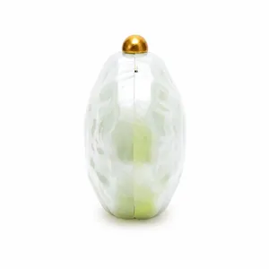 Detail of acrylic clutch with marble texture and polished gold sphere clasp closure