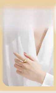 Detail view of retro gold-plated ring featuring a rectangular white mother-of-pearl inlay