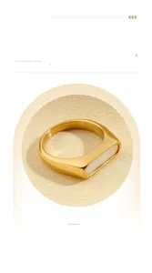 Macro detail of a gold signet ring with a rectangular mother of pearl inlay and polished finish