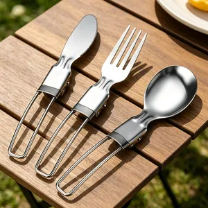 Three-piece stainless steel folding cutlery set including knife, fork, and spoon for camping