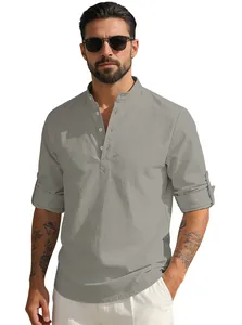Close-up of linen-textured grey shirt showing stand collar and roll-up sleeve detail