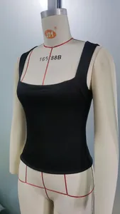Detail of black slim-fit square neck tank top showing thick elastic jersey texture