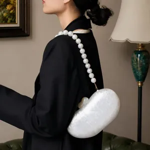 Elegant white acrylic evening clutch with marble texture and large pearl strap detail