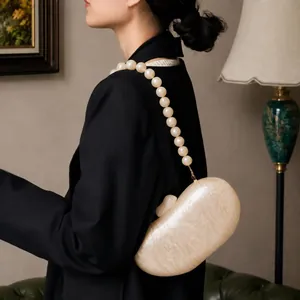 Elegant ivory pearl acrylic evening clutch bag with chunky faux pearl chain strap decor
