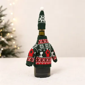 Close-up of a festive red and green knitted Christmas wine bottle sweater with a mini hat