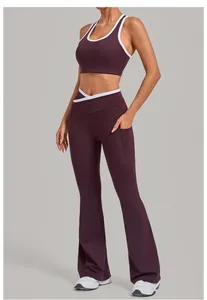 Detail of burgundy yoga set featuring V-shaped cross waist and functional side pockets