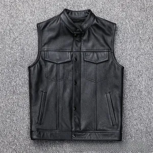 Detailed close-up of a black faux leather motorcycle vest with metal buttons and pockets