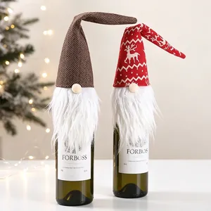 Detail of Christmas gnome wine bottle covers with white faux fur beards and festive knit hats