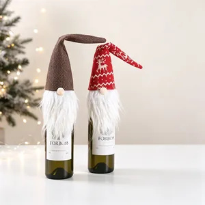 Detail of Christmas gnome wine bottle covers with gnome beard and festive knit patterns
