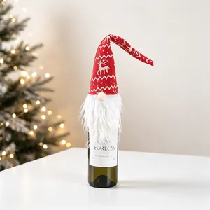 Christmas gnome wine bottle cover with red reindeer knit hat and white faux fur beard