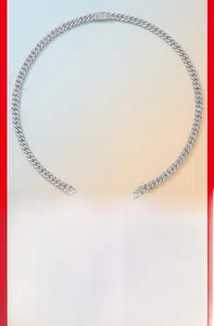 Close-up of pavé set Moissanite Cuban link necklace with rectangular box clasp