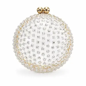 Detail of spherical acrylic evening clutch featuring crystals and gold ball clasp closure