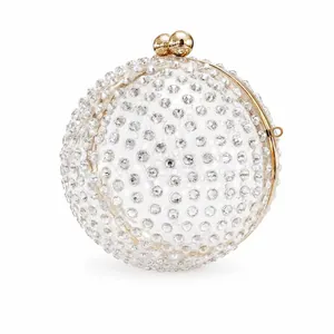 Sparkling acrylic sphere evening bag encrusted with rhinestones and gold hardware