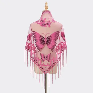 Close-up of pink lace shawl with butterfly embroidery and long tassel decorative fringes