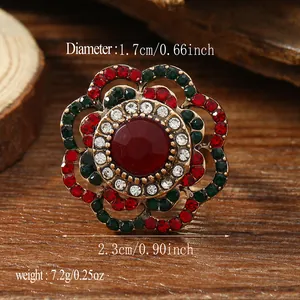 Bohemian retro floral ring with red gemstone and colorful rhinestones on wooden background
