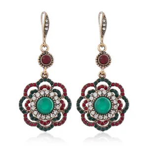 Bohemian vintage hollow flower drop earrings with green stones and colorful rhinestones