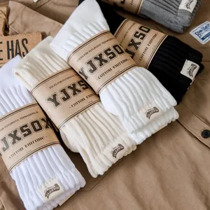 Vintage cotton crew socks set in neutral colors with retro texture and paper packaging