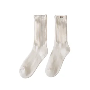 Off-white ribbed mid-calf cotton socks featuring a small decorative 'Happy Time' label