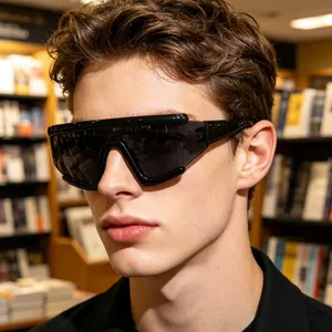 Close-up of oversized black wraparound sports sunglasses on a model for outdoor cycling