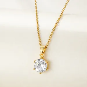 Macro shot of 18K gold plated necklace with a sparkling six-prong round zircon pendant