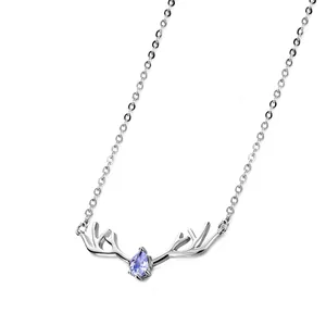 Silver-plated elk antler necklace with blue water-drop gemstone on white background