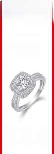 Detail of S925 silver moissanite ring showing circular halo setting and pave band