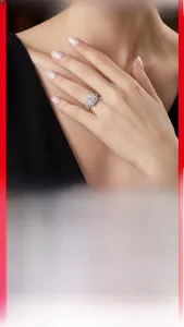 Macro detail of a 925 sterling silver moissanite ring with halo setting on a model