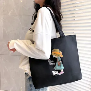 Large capacity black canvas tote bag with cartoon girl and cat graphic print