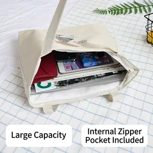 Large white canvas tote bag with cartoon print showing spacious interior and pockets