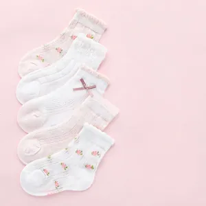 Five pack of girls' mesh knee-high socks with pink flower lace and bows