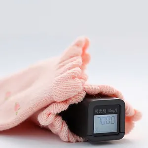 Breathable pink floral girls mesh socks showing a safe zero fluorescence test result