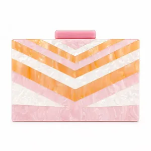Pink and orange marble patterned acrylic evening clutch bag with chain strap
