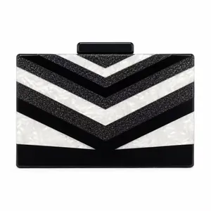 Modern acrylic clutch bag with black and white chevron stripes and shiny sequins