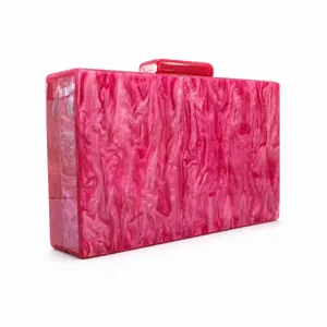 Close-up of pink marble acrylic evening clutch bag with rectangular top clasp detail