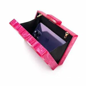 Pink marble acrylic evening clutch bag with gold chain strap for elegant dinner parties