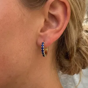 Elegant 18K gold plated hoop earrings featuring sparkling deep blue zircon gemstones