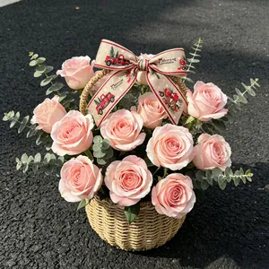 Detail of Christmas ribbon bow with Merry Christmas print on a rustic flower basket
