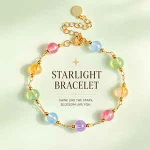 Macro view of natural multicolor crystal beads and gold metal spacers on this bracelet