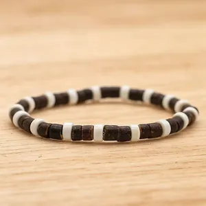 Handmade coconut shell and wooden beaded bracelet set for a natural layered ethnic look