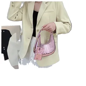 Pink metallic snake pattern hobo bag with a matching mini coin purse and zip closure