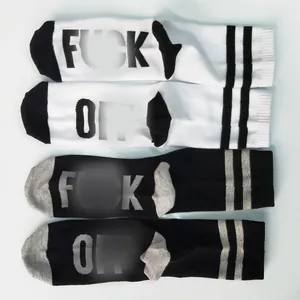 Detail of cotton crew socks featuring bold Fuck Off text print and athletic stripes