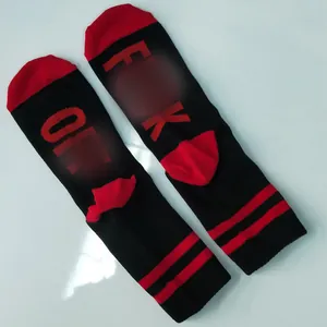 Detail view of cotton crew socks featuring red F*CK OFF text on the sole and striped design