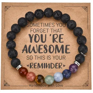 Chakra beaded bracelet with black lava stone and natural gemstones on display card
