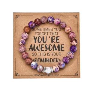 Close-up of 8mm heart-shaped beaded bracelet displayed on a kraft paper card