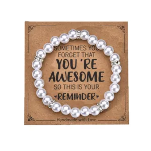 Detail of beaded pearl bracelet with rhinestone spacers on handmade with love card
