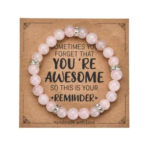 Detail of pink crystal beaded bracelet on a handmade gift card with silver spacers